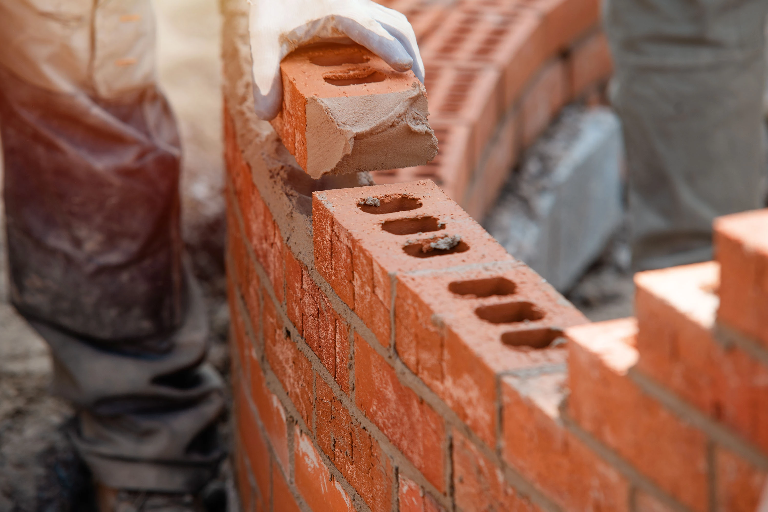 Person bricklaying as part of a HSS Training NVQ Course